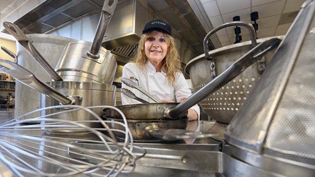 Janelle Domoney surrounded by kitchen tools